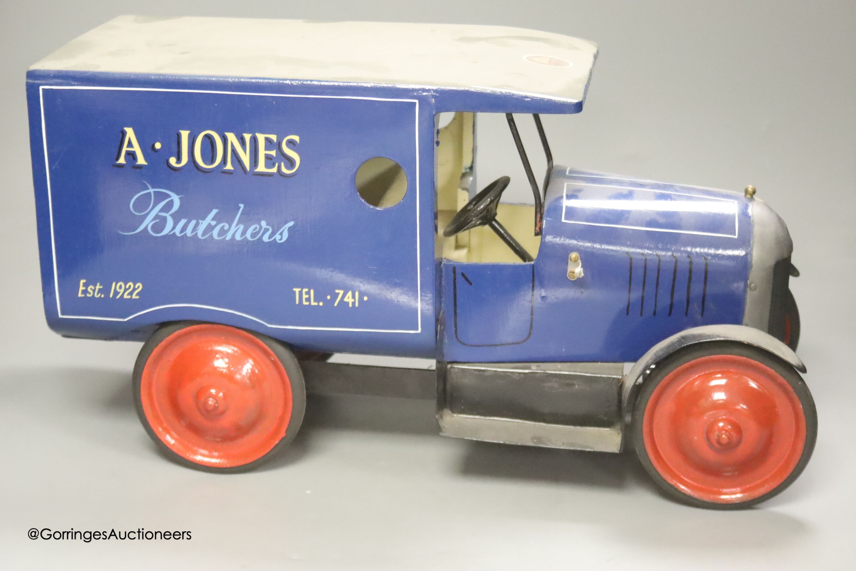 An A. Jones Butcher's painted metal model of a van, length 47cm height 25cm